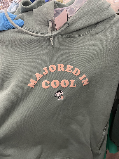 Michelle browsing clothes while thrifting